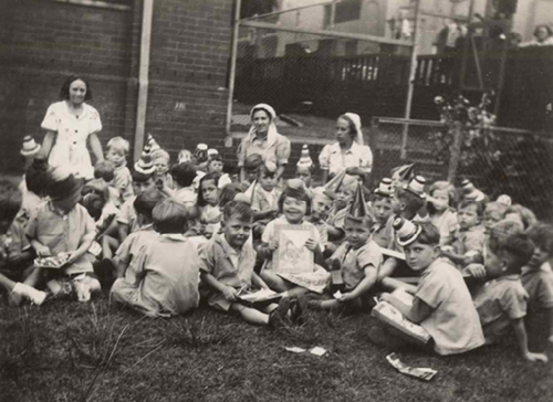 Outdoor party at Newtown Day Nursery and Nursery School, c. 1944